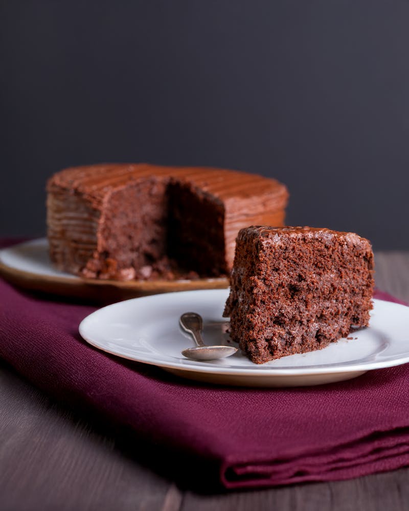 Perfectly baked brownies with a fudgy texture on a wooden table