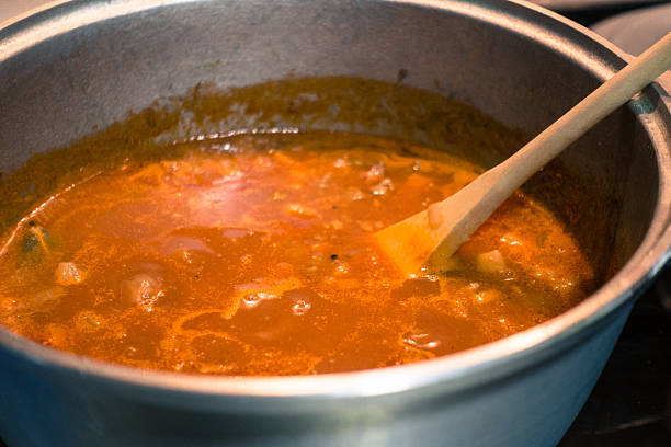  A simmering pot of Pasta Fagioli with beans, pasta, and a tomato-based broth.