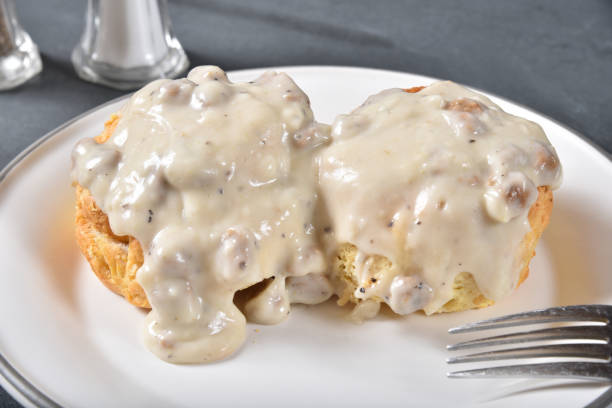 Classic Southern biscuits and gravy served on a plate.