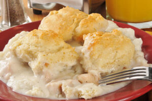 Biscuits and sausage gravy served on a plate