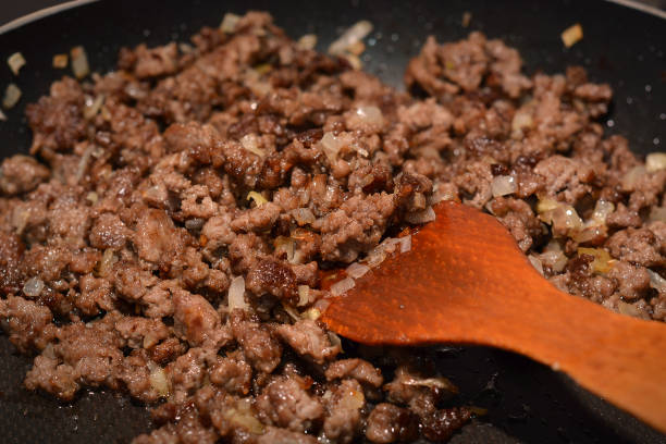 Ground beef and Italian sausage browning in a skillet for Pasta Fagioli