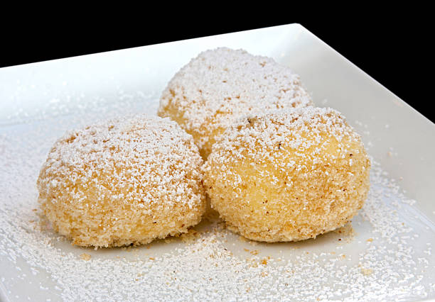 Sweet Bisquick dumplings with cinnamon sugar topping on a plate.