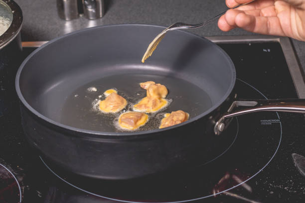 Crispy pan-fried dumplings in a non-stick pan