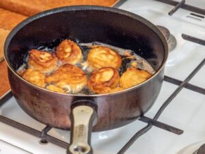 Dumplings with a crispy lace skirt in a pan