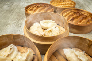 Steamed dumplings in a bamboo steamer to prevent mushiness.