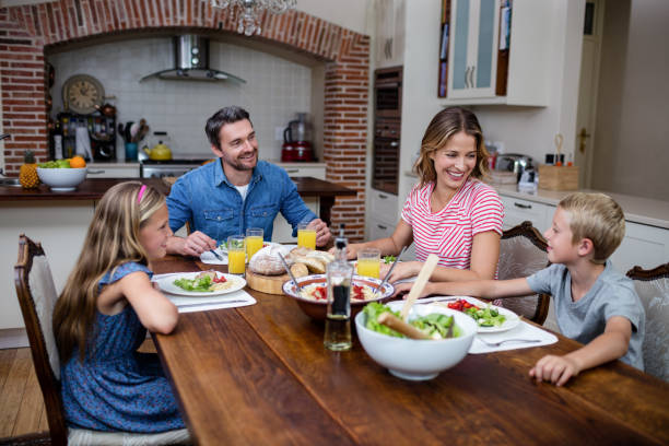 A family enjoying a meal together at a beautifully set dining table