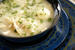 A bowl of fluffy Bisquick dumplings served with chicken stew