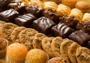 Rich chocolate brownies and chewy cookies displayed on a dessert tray