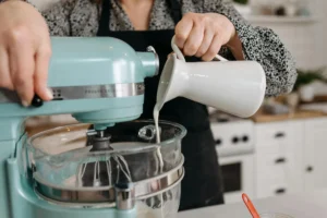 Adding buttermilk to biscuit dough for the perfect texture.