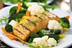 Light dinner with grilled salmon, steamed broccoli, and a side salad