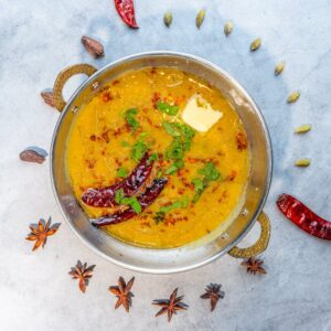 Lentil soup with spices and butter garnish, promoting blood sugar control