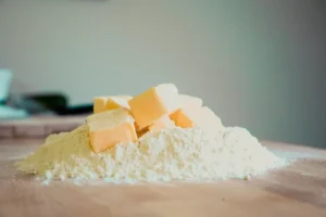 Mixing cold butter into flour for the biscuit method.